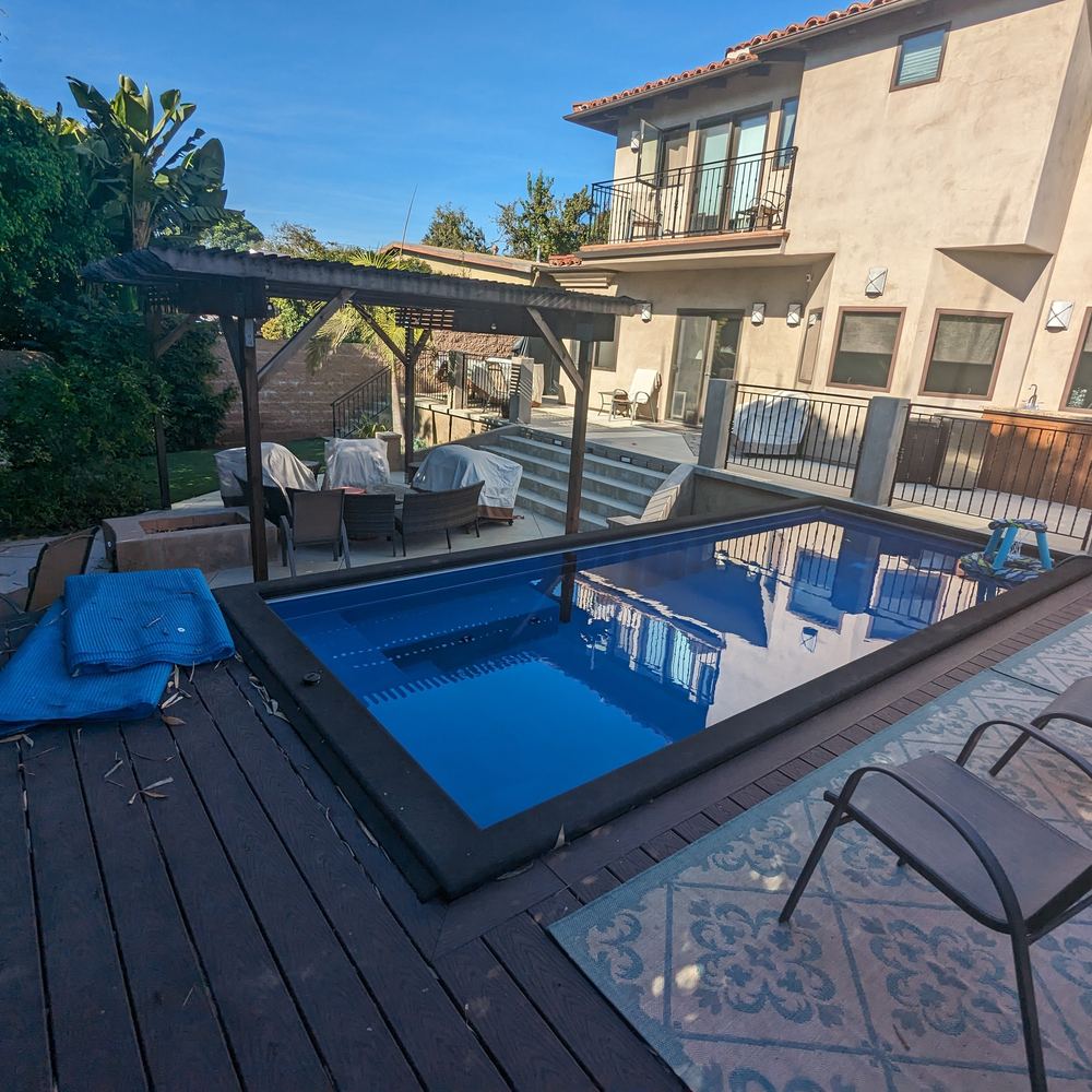 Backyard with a plunge pool, pergola, artificial turf and patio built by Del Mar Landscaping