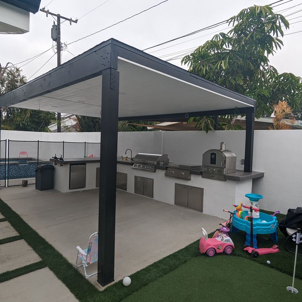 Pergola over a patio with turf and stepping pads