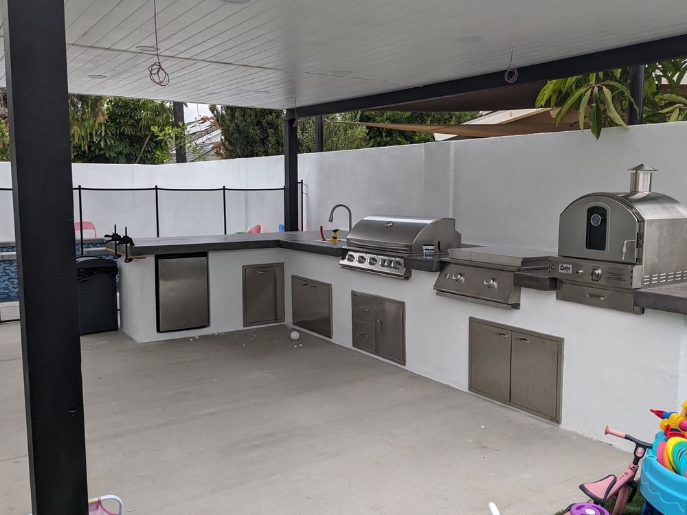 Covered outdoor kitchen on a concrete patio